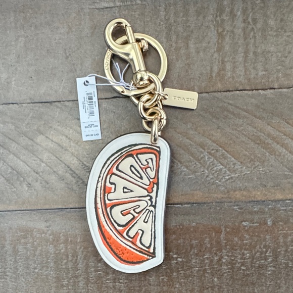 Coach Citrus Slice Keychain in Orange and Gold - Picture 1 of 4